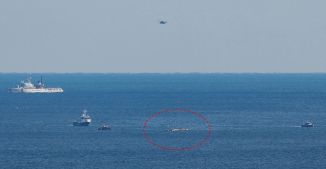 The Coast Guard prepares to conduct a rescue and towing operation for a fishing boat that capsized after colliding with a cargo ship in waters near Gyeongju, about 270 kilometers southeast of Seoul, on Dec. 9, Monday. (Yonhap)