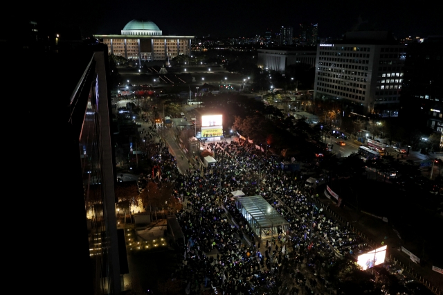 Protestors fill the streets in a rally to impeach President Yoon Suk Yeol in Yeouido, Seoul on Dec. 7. (Yonhap)
